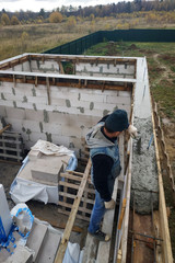 Naklejka na ściany i meble Place of foundation of new house, building, details and reinforcement of steel bars and wire rod, cement pouring.
