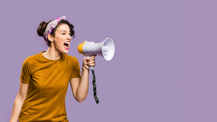 Woman shouts in megaphone with copy space