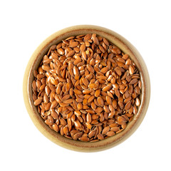 Flax seeds in a brown ceramic bowl isolated on a white background, top view.