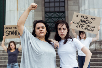 Young women demonstrating together