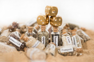 Glass test-tube with sand of different summer vacation countries.