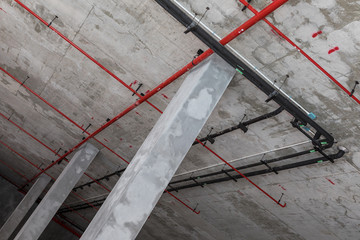 Fire protection system installation on bare skin ceiling.