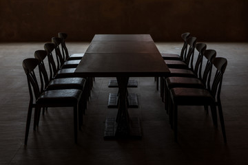 Dark board room. Stressful meeting concept.