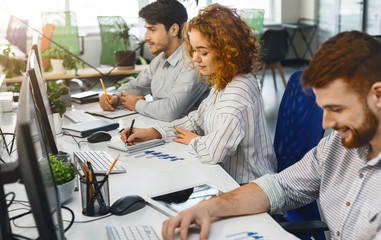 Fototapeta premium Young professional team working on marketing strategy in office