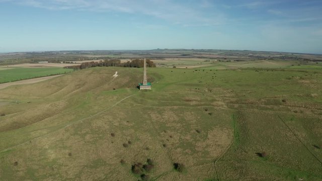 Aerial shot of a monument that stands on top of a hill in the England, the monument is close by to the white horse on Cherhill.
This was shot on a sunny autumn day.