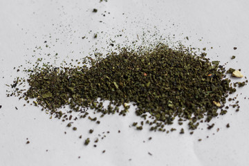 Green tea leaves isolated on white background