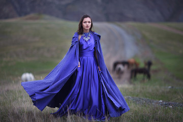 A girl walks in the mountains.
