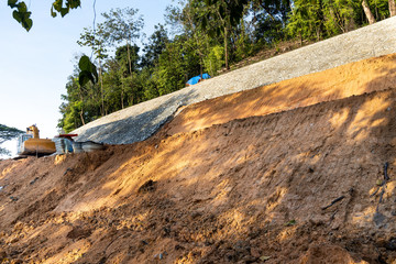 Slope retention construction work being carried out to manage landslide - Powered by Adobe