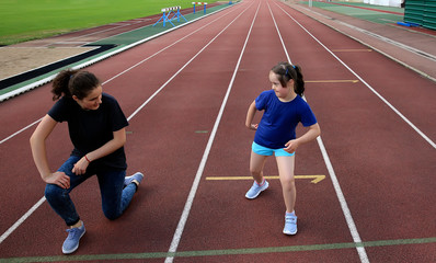 Fototapeta premium Little girl have fun on the stadium
