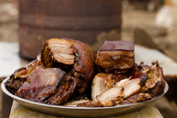 Traditional smoked bacon in a barrel