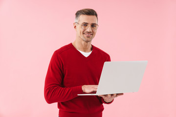 Mature man using laptop computer.