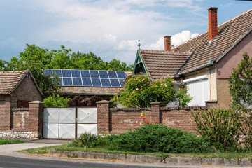 Solar panels on the roof of the cottage.