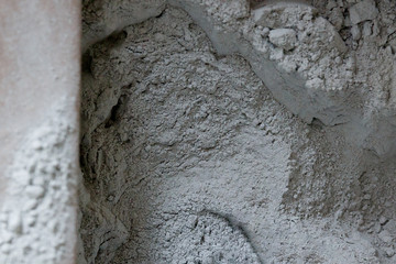 dry powder gray mortar in a paper bag