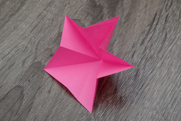 A folded origami paper star