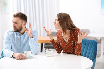 Obraz na płótnie Canvas Couple having quarrel in cafe. Relationship problems