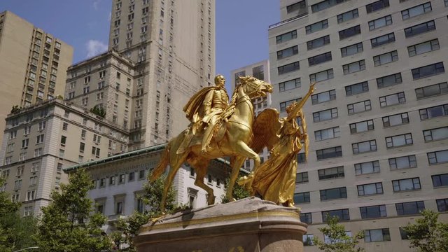 Circling General William Tecumseh Sherman statue near Central Park on bright sunny day