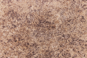 Brown-white marbled pattern with gold streaks. Abstract texture and background.