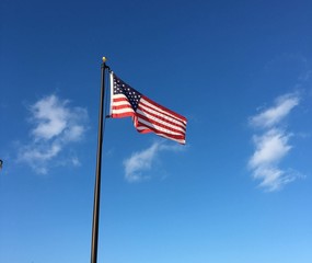 U.S. flag against blue sky