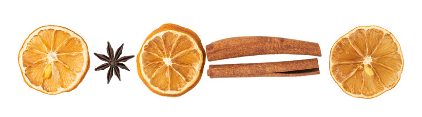 Cinnamon sticks, slices of dried lemon, star anise isolated on white background. Top view