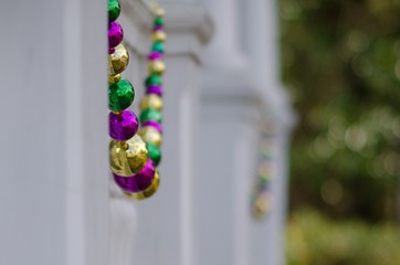 Mardi Gras Beads Decorating a House in Uptown New Orleans, Louisiana, USA