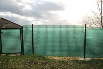 Green plastic screen to shade the garden