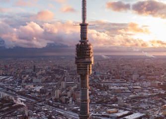 Ostankino television tower against the background of the winter city of Moscow from above, in the...