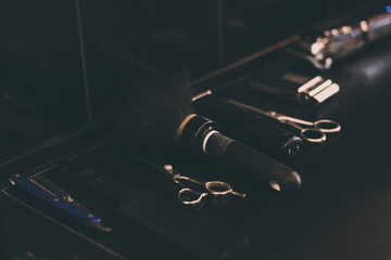 top view of various professional barber tools on table. toned image