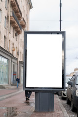 Vertical advertising billboard. Mockup for advertising in the city. Standing near the road
