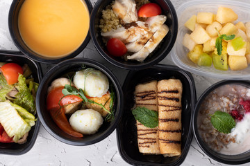 Meal prep of breakfast, lunch, and dinner for full day consisting of steel cut oatmeal, southwest chicken salad, and corned beef and pancakes