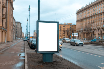Vertical advertising billboard. Mockup for advertising in the city. Standing near the road