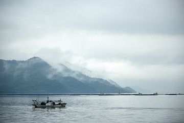 Fishing boat in the fog