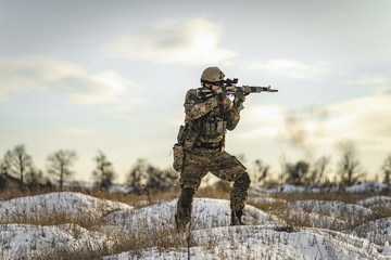 Ukrainian soldier shooting back and forth with the Russian military