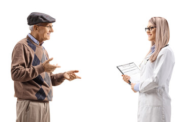 Senior man talking to a young female doctor