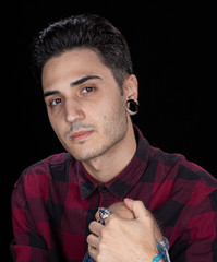 portrait handsome guy with plugs and shirt