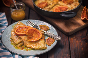 Sweet thin French crepes Suzette with orange sauce for a delicious breakfast