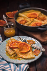 Sweet thin French crepes Suzette with orange sauce for a delicious breakfast