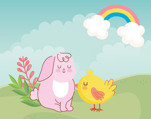 happy easter cute rabbit and chicken sitting in meadow