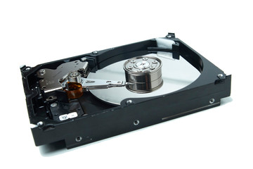 Opened hard disk drive, HDD. Disassembled hard drive from the computer on isolated white background