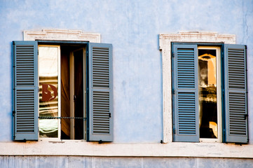Detail of the facade with windows with reflections in the Piazza della Rotonda, Rome, Italy