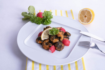 tasty shrimp dish on a white plate