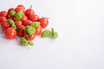 basil and fresh tomatoes on a table