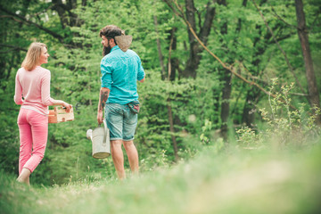 Lifestyle and family life. Crop planting at fields. Fresh organic vegetables from the farm. Two people walking in agricultural field.