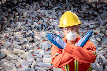 Recycling industry a worker who recycling thing on recycle center,Plastic bottle rubbish heap