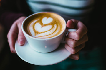 Holding Coffee Cup in the morning