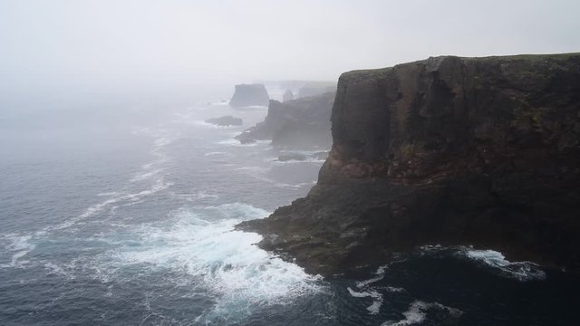 Sea stacks and cliffs in the mist at Eshaness / Esha Ness, peninsula in Northmavine on the island of Mainland, Shetland Islands, Scotland, UK