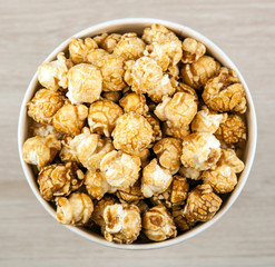 big cardboard cup with golden sugar popcorn