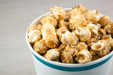 big cardboard cup with golden sugar popcorn