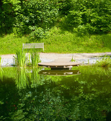 Fototapeta na wymiar Exotic park with terrace and pond
