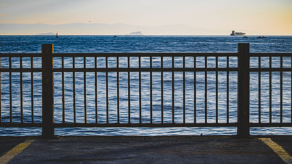 blue sea behind the fences and the ship