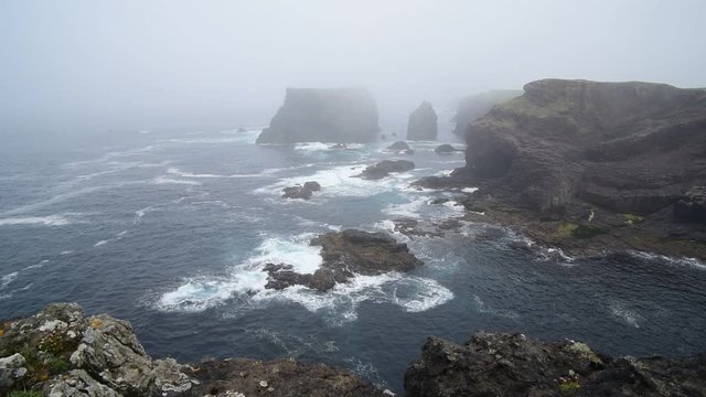 Sea stacks and cliffs in the mist at Eshaness / Esha Ness, peninsula in Northmavine on the island of Mainland, Shetland Islands, Scotland, UK